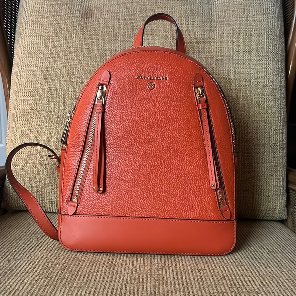 Orange Michael kors back pack